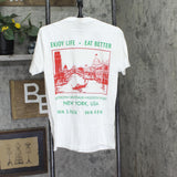 Monte's Fine Foods Eat Better Graphic Short Sleeve Pocket T-Shirt Tee White M